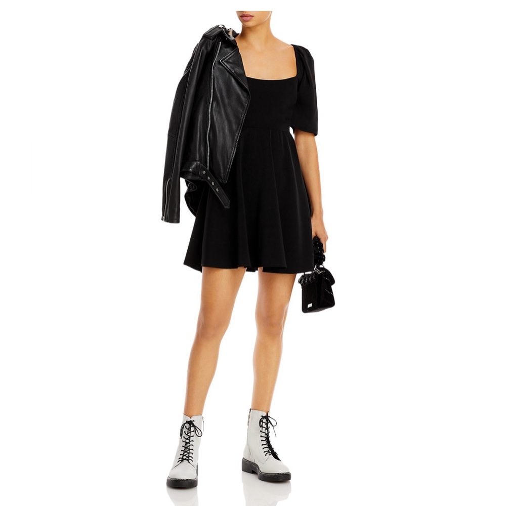 Black mini dress with small side cut outs.